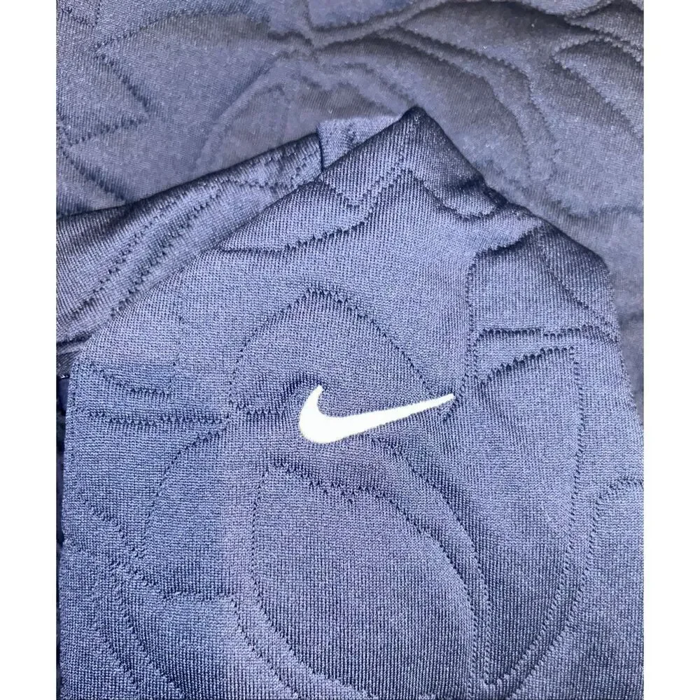Nike Women's Dri-FIT Long-Sleeve Golf Mid Layer pullover in navy blue with a sub